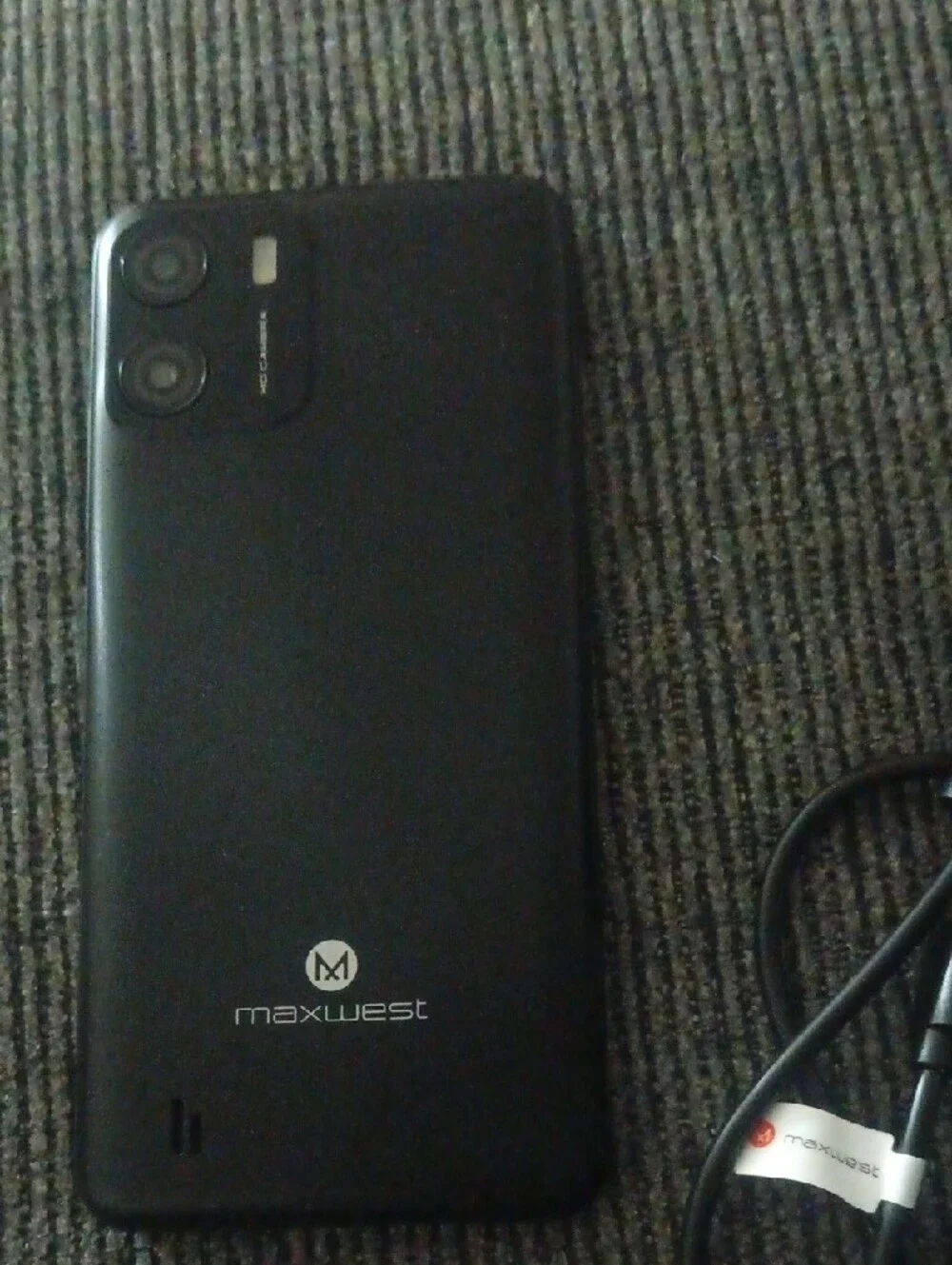Black Smartphone with Charger - Reliable Mobile Device